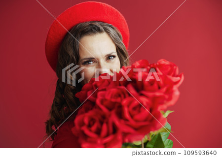 elegant woman in dress and beret on background 109593640