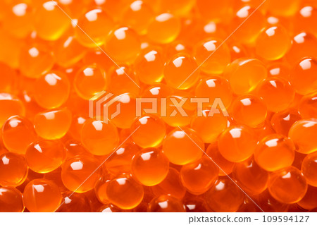 Closeup of natural red caviar as background, texture of expensive luxury fresh orange caviar macro photo 109594127