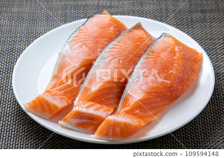 Three pieces of coho salmon fillet. Three pieces of coho salmon fillet. 109594148