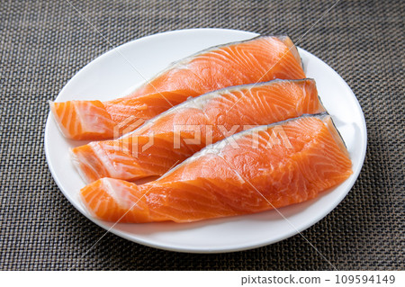 Three pieces of coho salmon fillet. Three pieces of coho salmon fillet. 109594149