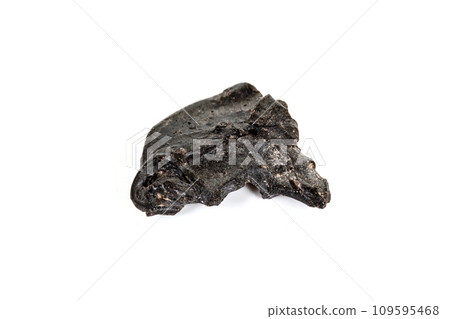 Macro stone mineral meteorite tektite on white background 109595468