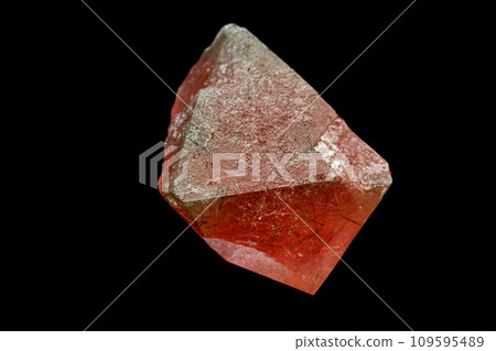 macro mineral stone pink fluorite on a black background 109595489