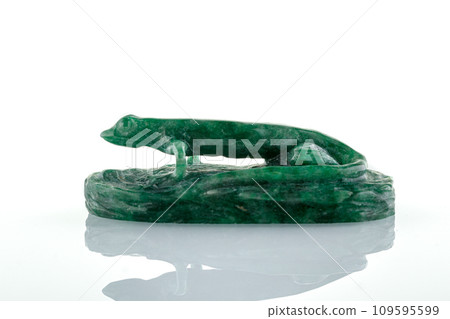beautiful statuette of lizard salamander from malachite on a white background beautiful statuette of lizard salamander from malachite on a white background 109595599