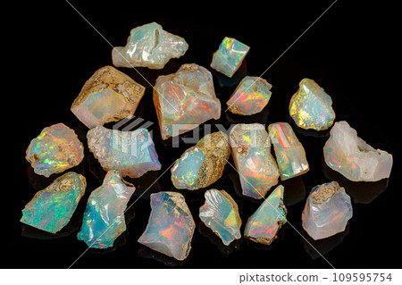 macro mineral stone rare and beautiful opals on a black background macro mineral stone rare and beautiful opals on a black background 109595754