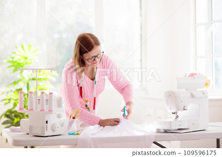 Sewing machine. Fashion design workshop. 109596175