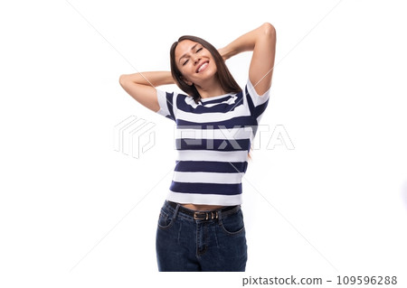 close-up of a young brunette woman model dressed in a striped t-shirt and jeans. people lifestyle 109596288