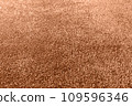 Carpet texture close up, indoors interior design toned with color of the year Peach Fuzz 109596346