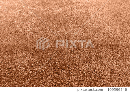 Carpet texture close up, indoors interior design toned with color of the year Peach Fuzz Carpet texture close up, indoors interior design toned with color of the year Peach Fuzz 109596346