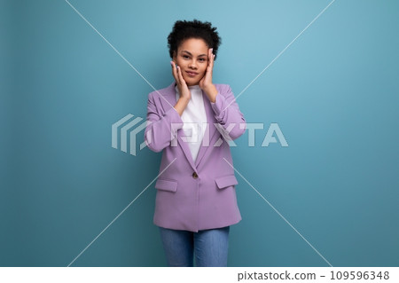 young brunette latin secretary woman dressed in purple jacket on studio background with copy space young brunette latin secretary woman dressed in purple jacket on studio background with copy space 109596348
