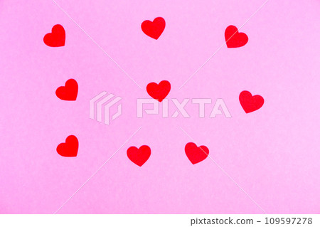 red hearts on a pink background for a greeting card or banner for Valentine's Day. 109597278