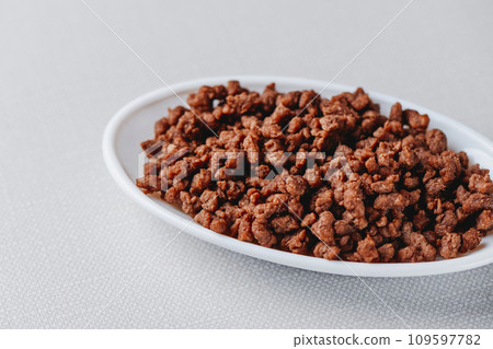 fried mock ground meat in an oval white dish 109597782