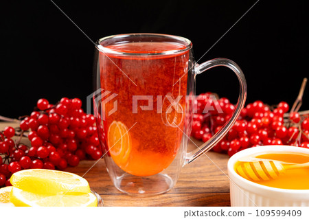 Vitamin berry viburnum tea with honey and lemon Vitamin berry viburnum tea with honey and lemon 109599409