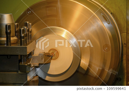 Closeup scene the lathe machine finish cut the metal parts by lathe tools. Closeup scene the lathe machine finish cut the metal parts by lathe tools. 109599641
