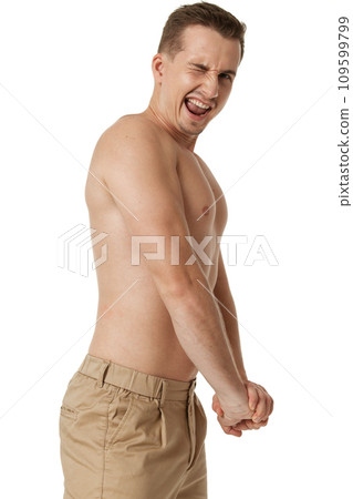 young man showing his bicep over white background young man showing his bicep over white background 109599799