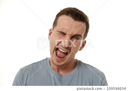portrait of young happy man winking looking at the camera on white background portrait of young happy man winking looking at the camera on white background 109599834