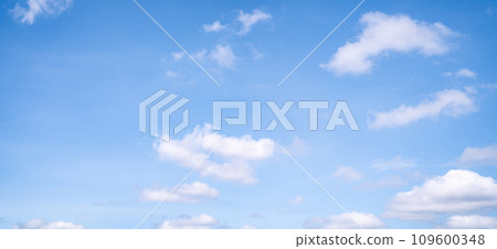 Beautiful blue sky and white cumulus clouds abstract background. Cloudscape background. Blue sky and fluffy white clouds on sunny days. Blue sky and daylight. World Ozone Day. Ozone layer. Summer sky. 109600348