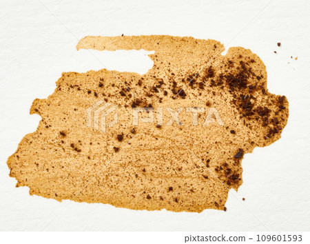 Spilled black coffee on a white background, blot 109601593