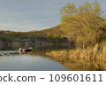 Fishing boat heading out at sunset, Patagonia Lake State Park, Arizona, USA 109601611