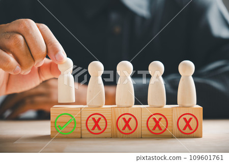 Wooden block held by businessman hand displays a check mark representing an employment choice. Reflects business service rating and satisfaction concept. Think With Yes Or No Choice. 109601761