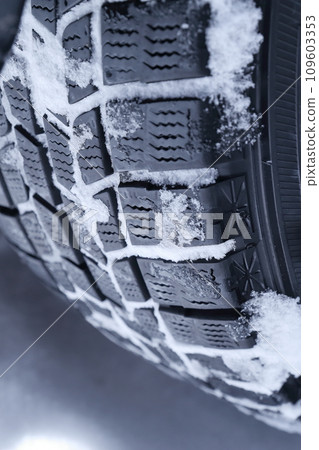 Studless tires with snow on them 109603353