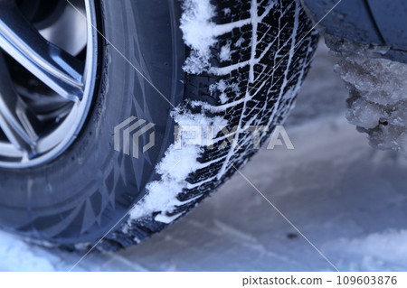 Studless tires with snow on them 109603876