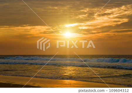 Bright sunrise over the sea. 109604312