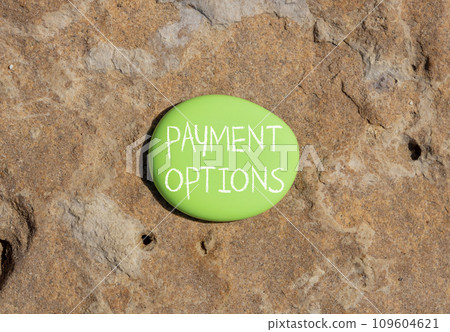 Payment options symbol. Concept words Payment options on beautiful green stone. Beautiful brown stone background. Business payment options concept. Copy space. Payment options symbol. Concept words Payment options on beautiful green stone. Beautiful brown stone background. Business payment options concept. Copy space. 109604621