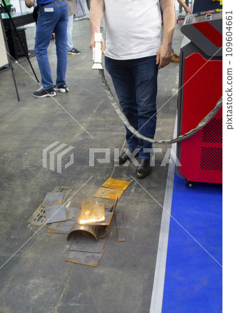 Laser metal cleaning. Metal cleaning with laser from rust. New modern innovative technologies. Metal laser cleaning with portable equipment. Cleansing laser. Highly concentrated powerful radiation. 109604661