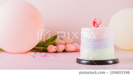 Colored cotton candy cake and party decorations on the table web banner 109605396
