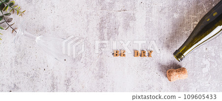 Sober January concept, text, glass and bottle on the table top view web banner Sober January concept, text, glass and bottle on the table top view web banner 109605433