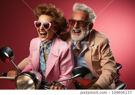 AI-generated content. Senior elderly couple rides a vintage motorcycle, isolated on pink background. Issues with aging population concept. 109606137