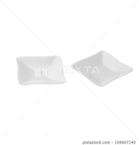 Two white plastic dessert plates isolated over white background Two white plastic dessert plates isolated over white background 109607140