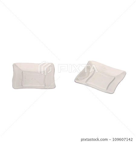 Two transparent plastic dessert plates isolated over white background Two transparent plastic dessert plates isolated over white background 109607142