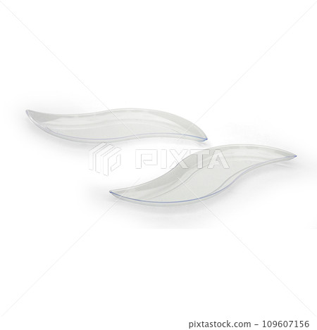 Two transparent plastic dessert plates isolated over white background Two transparent plastic dessert plates isolated over white background 109607156
