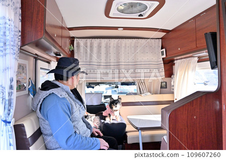 Male owner and two Chihuahuas, winter camper trip, camping, outdoors Male owner and two Chihuahuas, winter camper trip, camping, outdoors 109607260