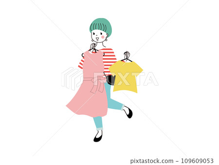 Shopping A smiling woman choosing clothes while holding them against her body Shopping A smiling woman choosing clothes while holding them against her body 109609053