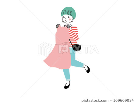 Shopping woman holding clothes against her body Shopping woman holding clothes against her body 109609054