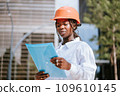 Young African American female engineer checking documents 109610145