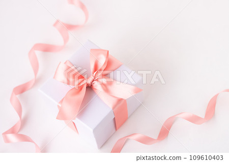 Delicate, gentle and soft color, gift of coral pink ribbon 109610403