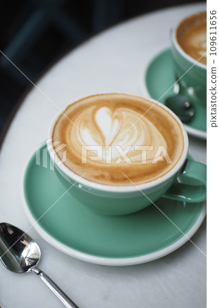 Coffee cup on wood table Coffee cup on wood table 109611656