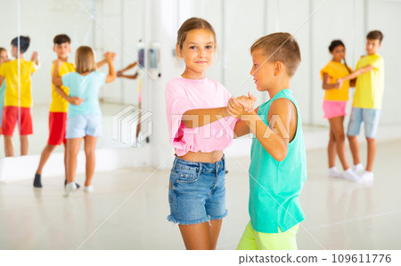 Portrait of children enjoying of partner dance in class Portrait of children enjoying of partner dance in class 109611776