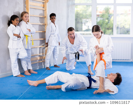 Boy and girl training judo technique 109611817
