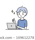 A man doing a thumbs up in front of a computer 109612278