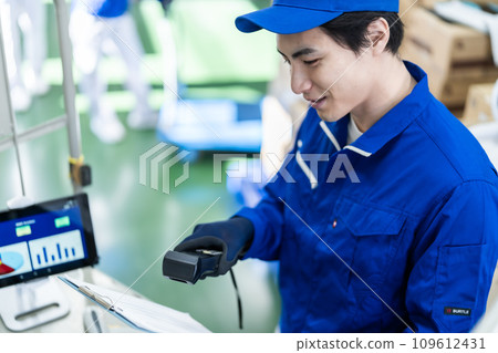 Young logistics guy checking shipping list Young logistics guy checking shipping list 109612431