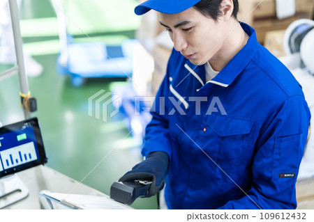 Young logistics guy checking shipping list Young logistics guy checking shipping list 109612432