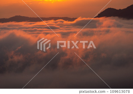 Beautiful dramatic sunset in the mountains. Landscape lot of fog Phu Thok Mountain at Chiang Khan ,Loei Province in Thailand. Beautiful dramatic sunset in the mountains. Landscape lot of fog Phu Thok Mountain at Chiang Khan ,Loei Province in Thailand. 109613078