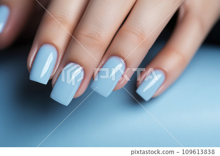 Glamour woman hand with baby blue nail polish on her fingernails. Blue nail manicure with gel polish at luxury beauty salon. Nail art and design. Female hand model. French manicure. Generative AI. Glamour woman hand with baby blue nail polish on her fingernails. Blue nail manicure with gel polish at luxury beauty salon. Nail art and design. Female hand model. French manicure. Generative AI. 109613838
