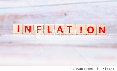 Inflation word made of wooden cubes on a light background Inflation word made of wooden cubes on a light background 109615423