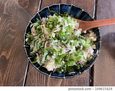 A combination of aromatic vegetables: Japanese ginger, perilla leaves, and green onions as condiments. A combination of aromatic vegetables: Japanese ginger, perilla leaves, and green onions as condiments. 109615828