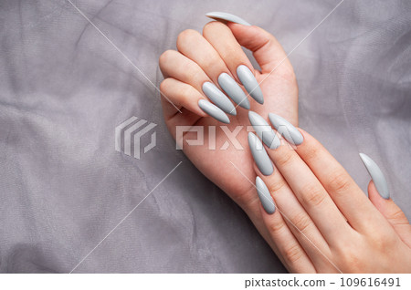 Grey nails on grey lace background. Grey nails on grey lace background. 109616491